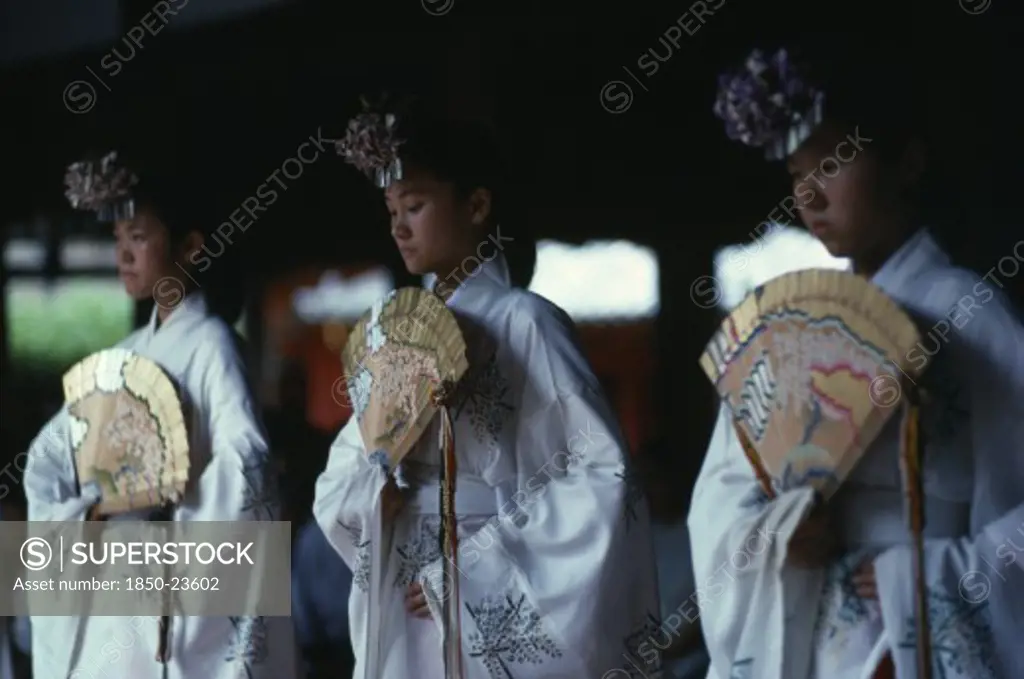 Japan, Honshu, Nara, 'At Kasuga Shrine, The Shrine Maidens, Miki, Perform One Of The Sacred Kagura Dances.  Ancient Dance Form, With Words Of The Musical Accompaniment Written By Former Emperor Hirohito And Expressing His Wish For World Peace.'