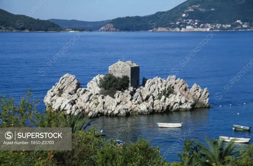Montenegro, Przno, Fortified Building Built Into Rock Formation Off The Coast