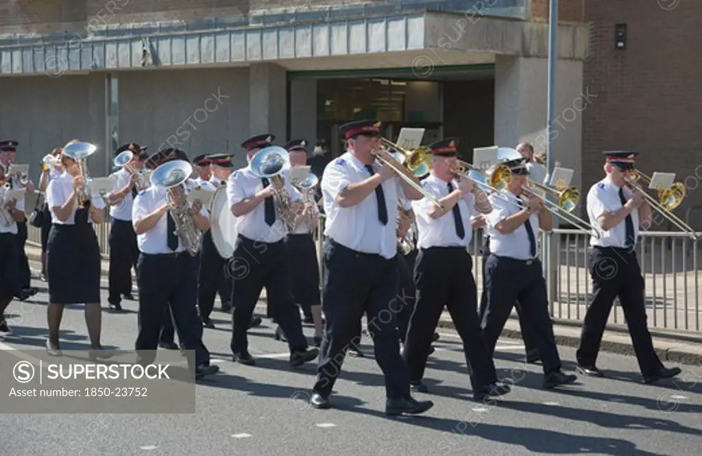 England, West Sussex, Worthing, The Salvation Army Band Marching Along Seafront In The Summer.