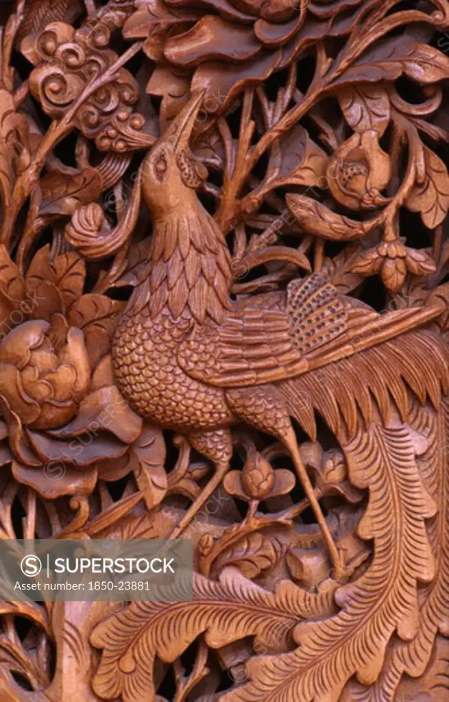China, Yunnan Province, Dali, 'Detail Of Traditional Door Carving Depicting Bird, Leaves And Flowers.'