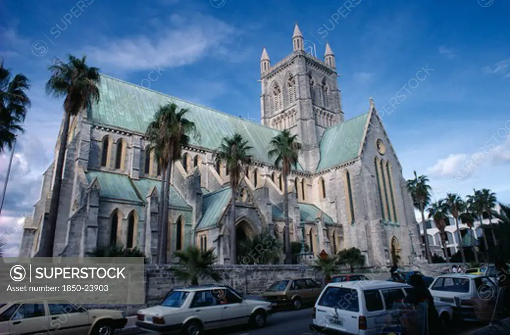 Bermuda, Hamilton, Cathedral Of The Most Holy Trinity.  Exterior With Busy Street In Foreground.