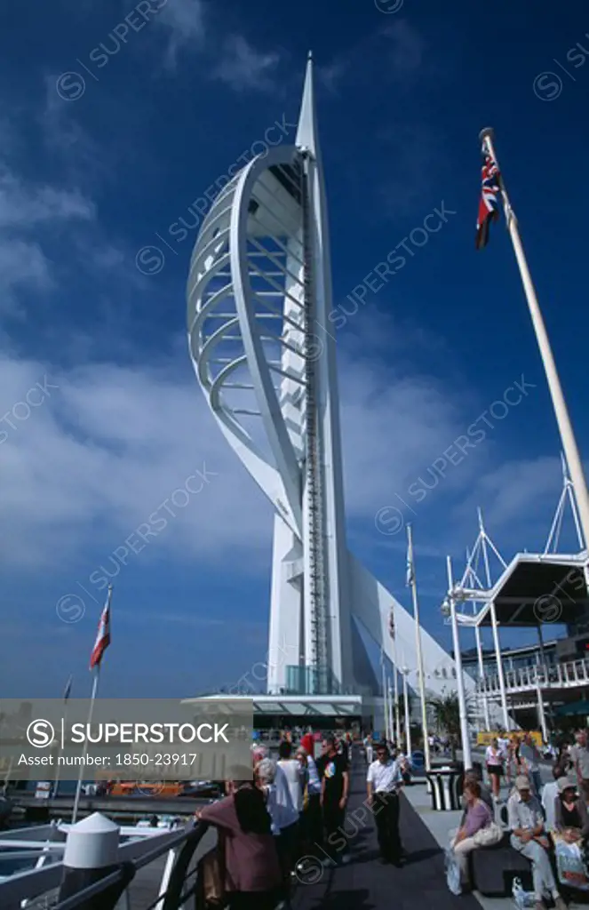 England, Hampshire, Portsmouth, Gunwharf Keys. The Spinnaker Tower With People On The Waterfront Promenade Looking Out Across The Marina