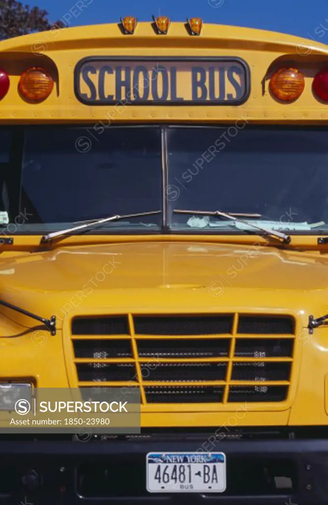 Usa, New York, New York City, 'Cropped Shot Of Bright Yellow Front Bumper, Windscreen And Number Plate Of School Bus.'