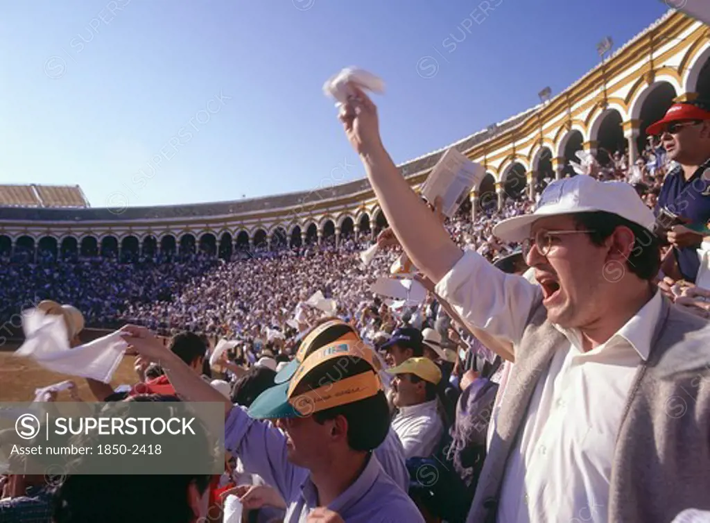 Spain, Andalucia, Seville, 'Arenal District, White Handkerchiefs Being Waved By The Crowd In The Stands In The Bullring'