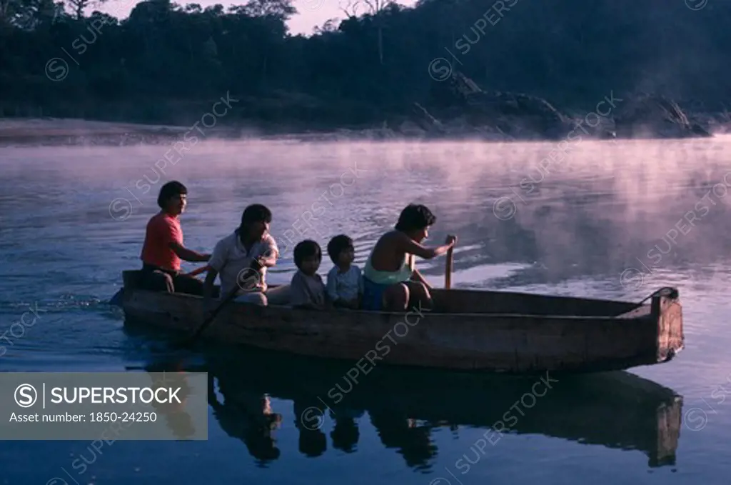 Brazil, River Tocantins, Ava-Canoeiros People Canoeing On The River Tocantins Near Their Settlement.