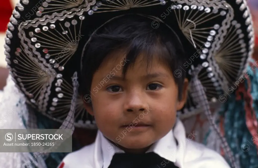 Mexico, Puebla, Huejotzingo, Head And Shoulders Portrait Of Young Boy Dressed For Carnival.