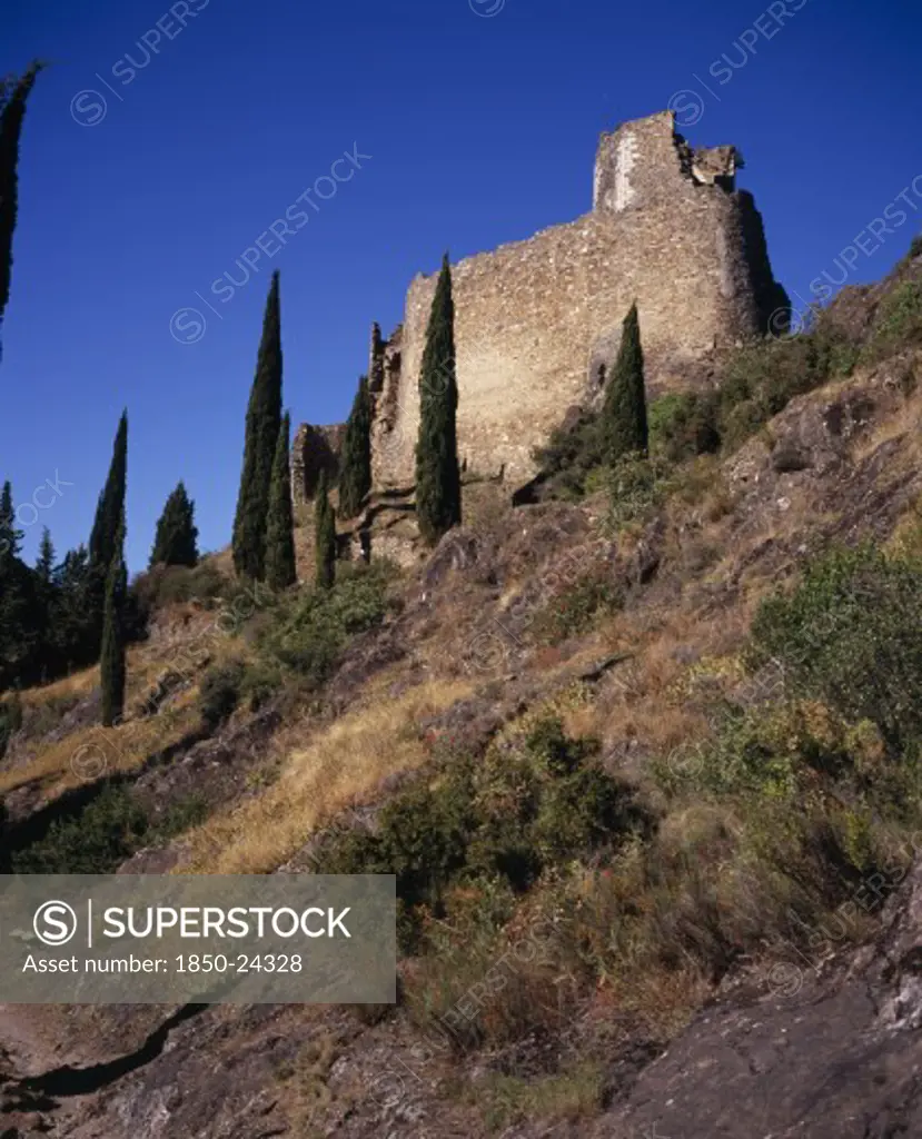 France, Languedoc-Roussillon, Aude, 'Chateaux De Lastours, Cathar Castles.  Chateau Cabaret Dating From The Mid-Eleventh Century Set On Hillside With Cypress Trees.'