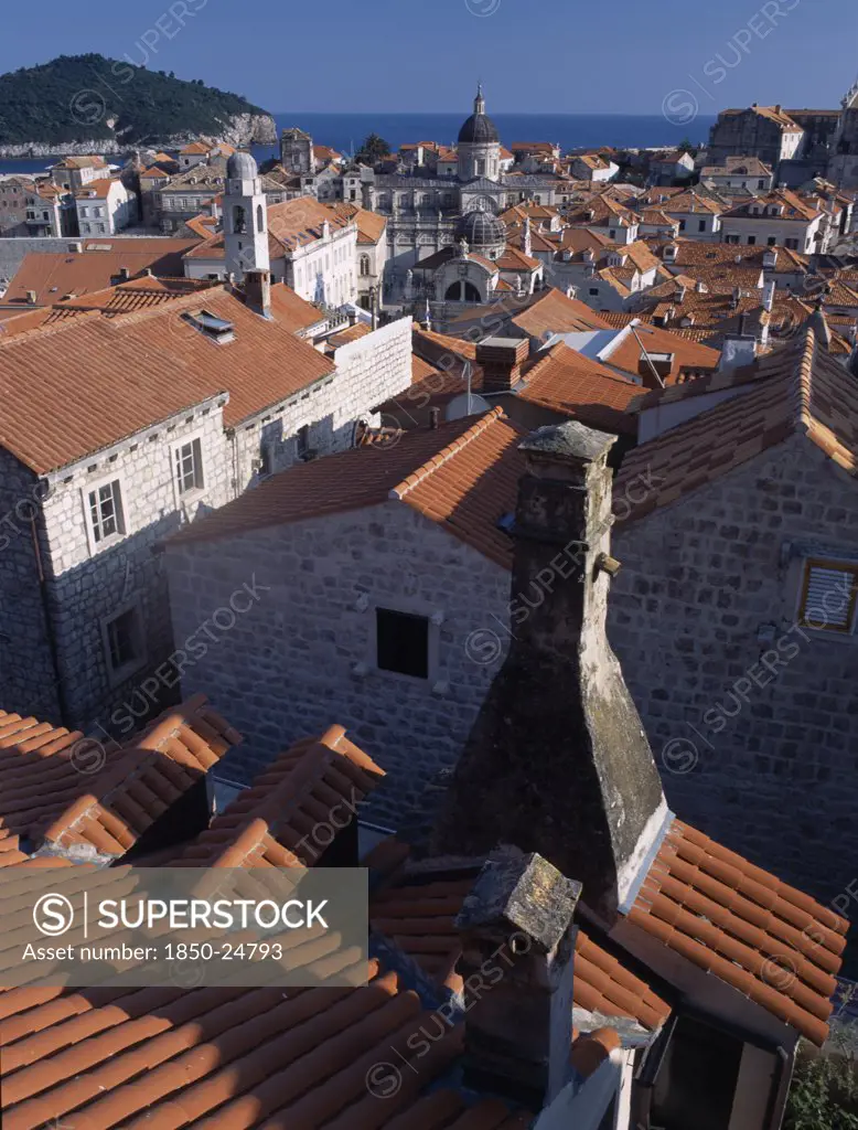 Croatia, Dalmatia, Dubrovnik, 'Elevated View Over Terracotta Roof Tops Towards The Cathedral, St BlaiseS Church And Clock Tower In Morning Light.'