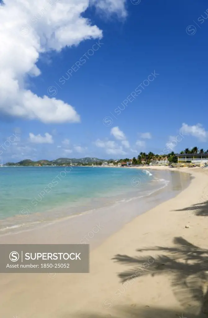 West Indies, St Lucia, Gros Islet, Reduit Beach In Rodney Bay With Tourists In The Water And On The Beach