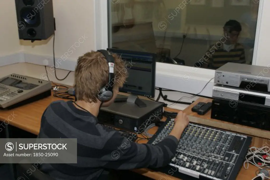 Children, Education, Secondary, Students Using Sound Desk In School Recording Studio.