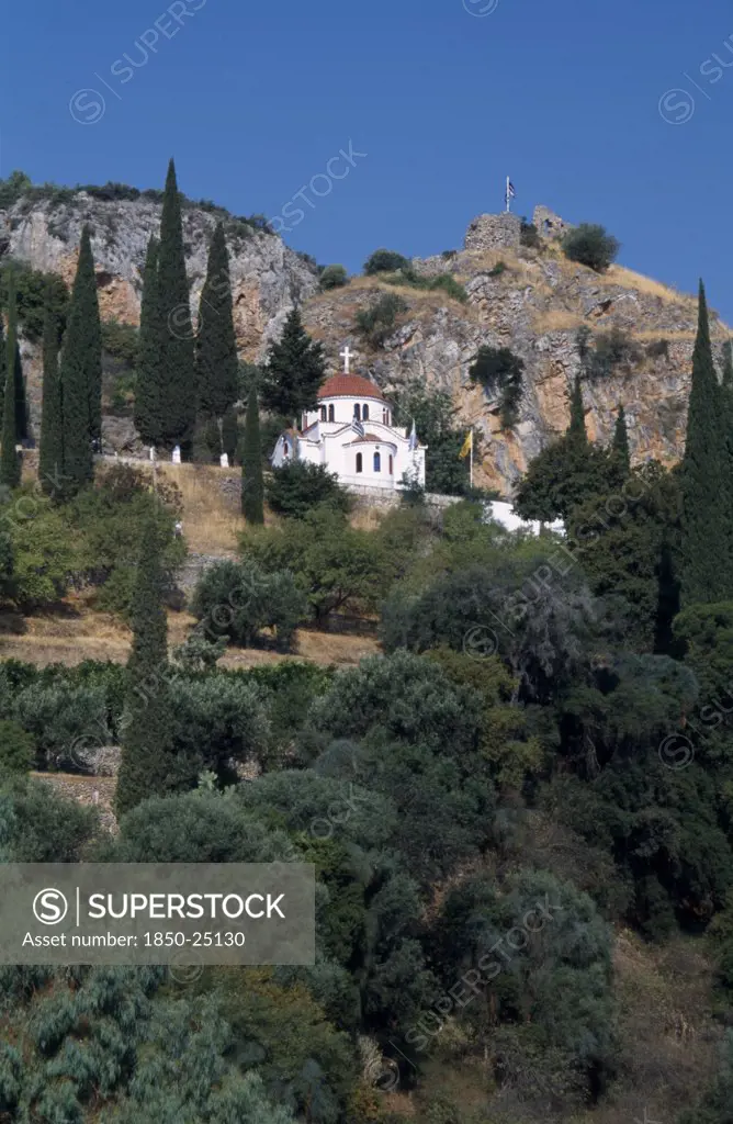 Greece, Peloponnese, Molai , White Church With Red Tilled Dome On Tree Covered Hillside