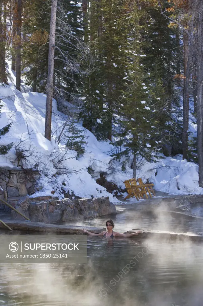 Usa, Colorado, Steamboat Springs, Woman In The Outdoor Hot Pool Of The Spa Resort.