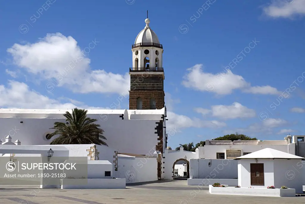 Spain, Canary  Islands, Lanzarote, 'Teguise, The Former Capital Of The Island.  Church Of Nuestra Senora De Guadalupe Also Known As Iglesia De San Miguel White Painted Exterior And Bell Tower.'
