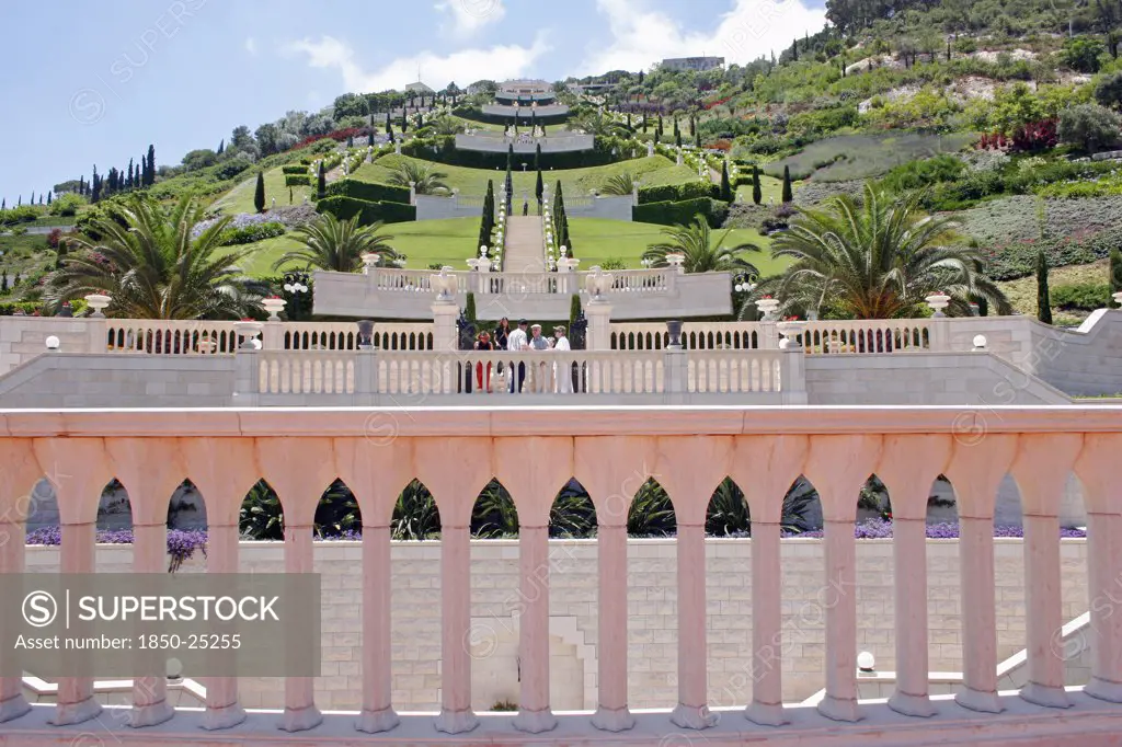 Israel, Northern Coast, Haifa, Zionism Avenue.  View Of Baha'I Gardens Built As Memorial To Founders Of The BahaI Faith.  Colonnaded Balcony In Foreground With View Across Tiered Gardens Stretching Out Beyond.