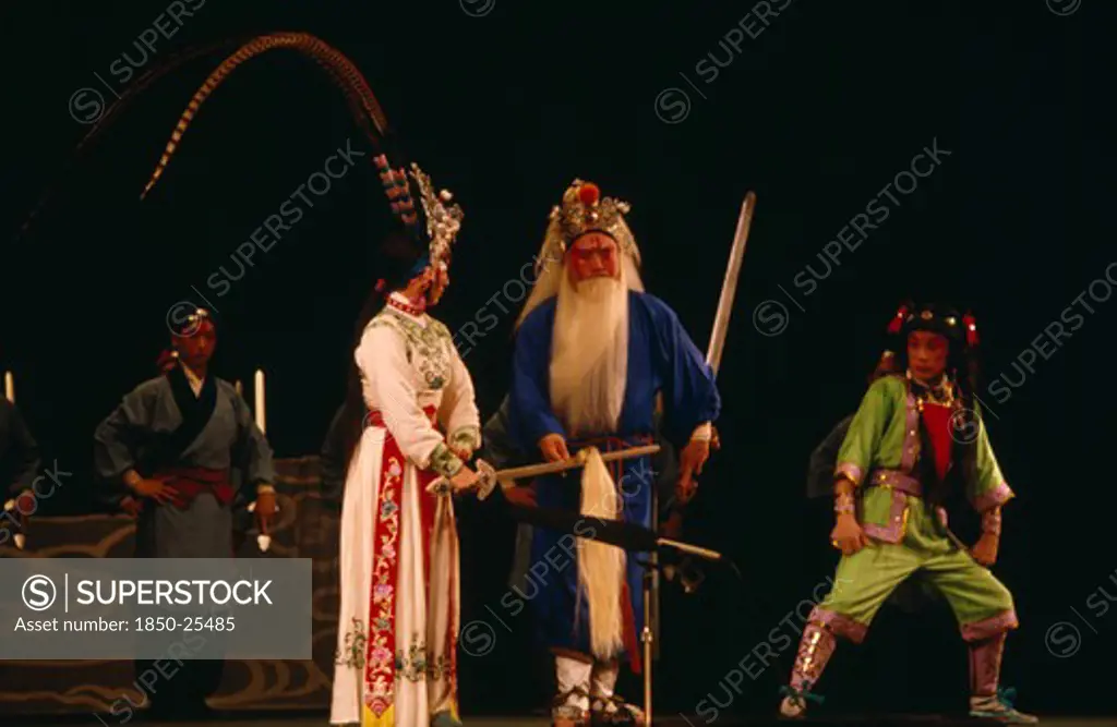 China, Hebei, Beijing, Chinese Opera With Male And Female Performers Dressed In Costume On Stage