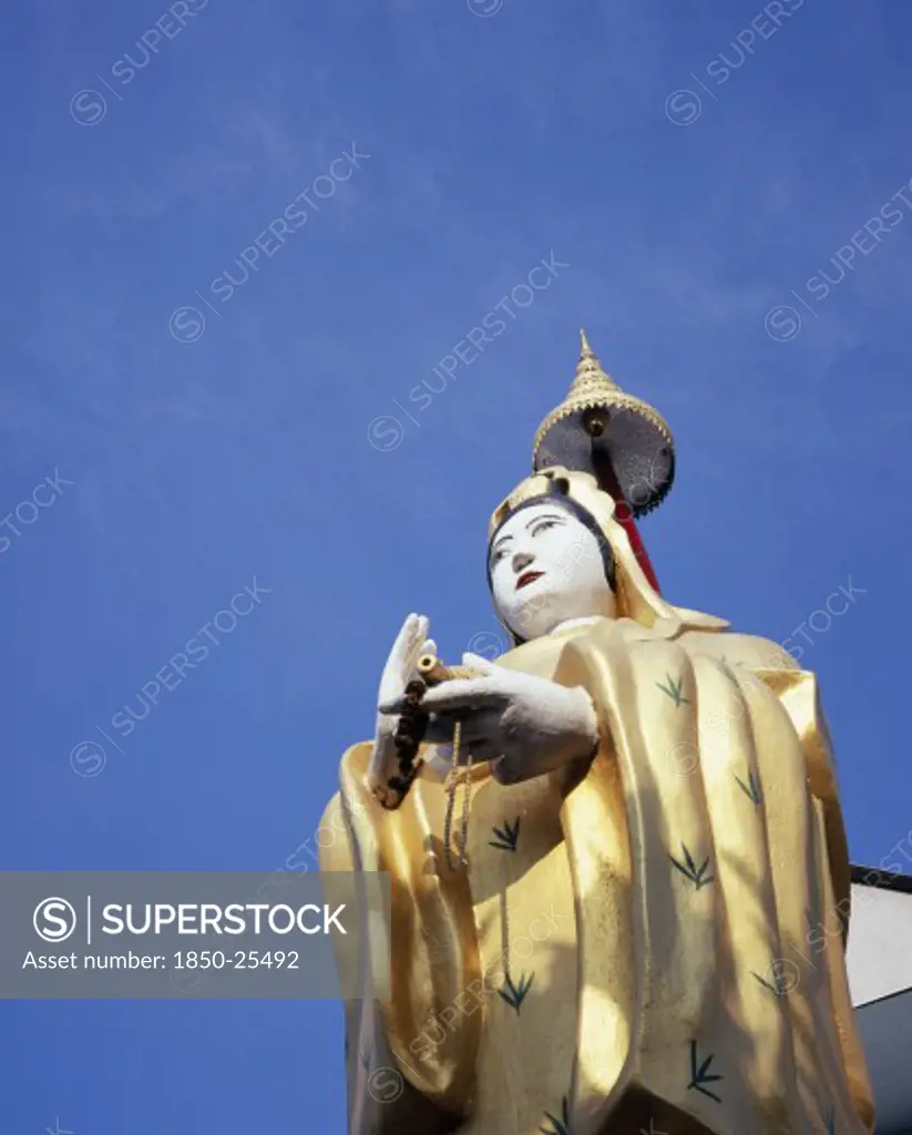 Thailand, Bangkok, 'Wat Ratchasingkhon Temple On The Banks Of The Chao Phraya River.  Guanyin Goddess Of Mercy Statue, The Bodhisattva Of Compassion As Venerated By East Asian Buddhists Usually Depicted As A Female Figure.'