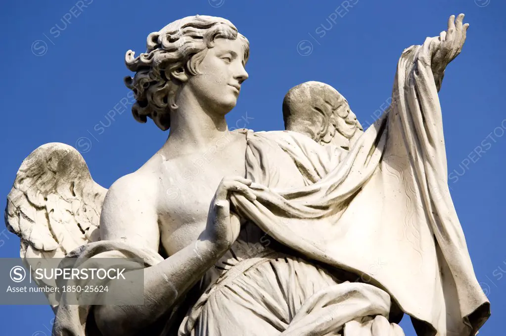 Italy, Lazio, Rome, Statue Of A Winged Female Angel On The Ponte Sant Angelo Bridge Over The River Tiber