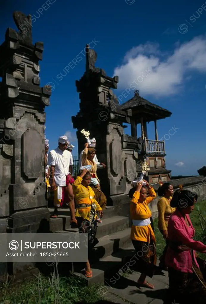 Indonesia, Bali, Besakih Temple, Procession Of Mourners Leaving Cremation Ceremony In Temple Grounds.  Besakih Temple Is Situated On Mount Agung And Known As The Mother Temple Of Bali.