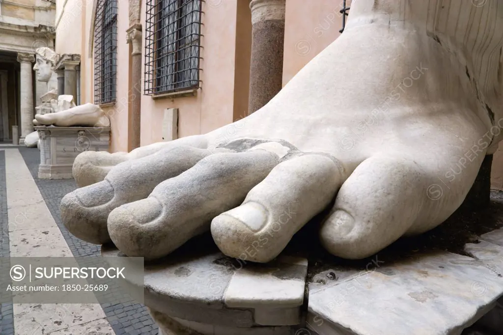 Italy, Lazio, Rome, The Courtyard Of The Palazzo Dei Conservatori Part Of The Capitoline Museum With Large Marble Feet From Colossal Ancient Statues