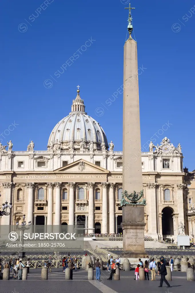 Italy, Lazio, Rome, Vatican City St Peters Square With Tourists And The Facade Of St Peters Basilica Beyond The Obelisk