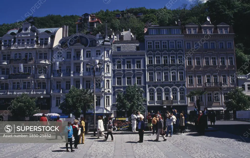 Czech Republic, Western Bohemia, Karlovy Vary, 'Square In Spa City With Crowds Of Visitors Overlooked By Tall, Narrow Buildings Painted In Pastel Colours. '