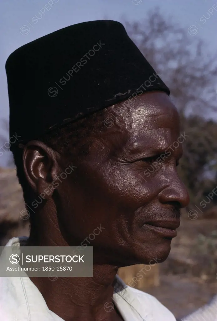 Malawi, Tribal People, Yau Tribe, Head And Shoulders Portrait Side Profile Of A Man From The Yau Tribe Wearing A Black Hat