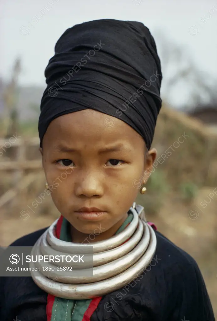 Laos, Tribal People, Meo Tribe, Head And Shoulders Portrait Of A Meo Girl Wearing Traditional Dress And Silver Bars Around Her Neck Which Are Used As Money