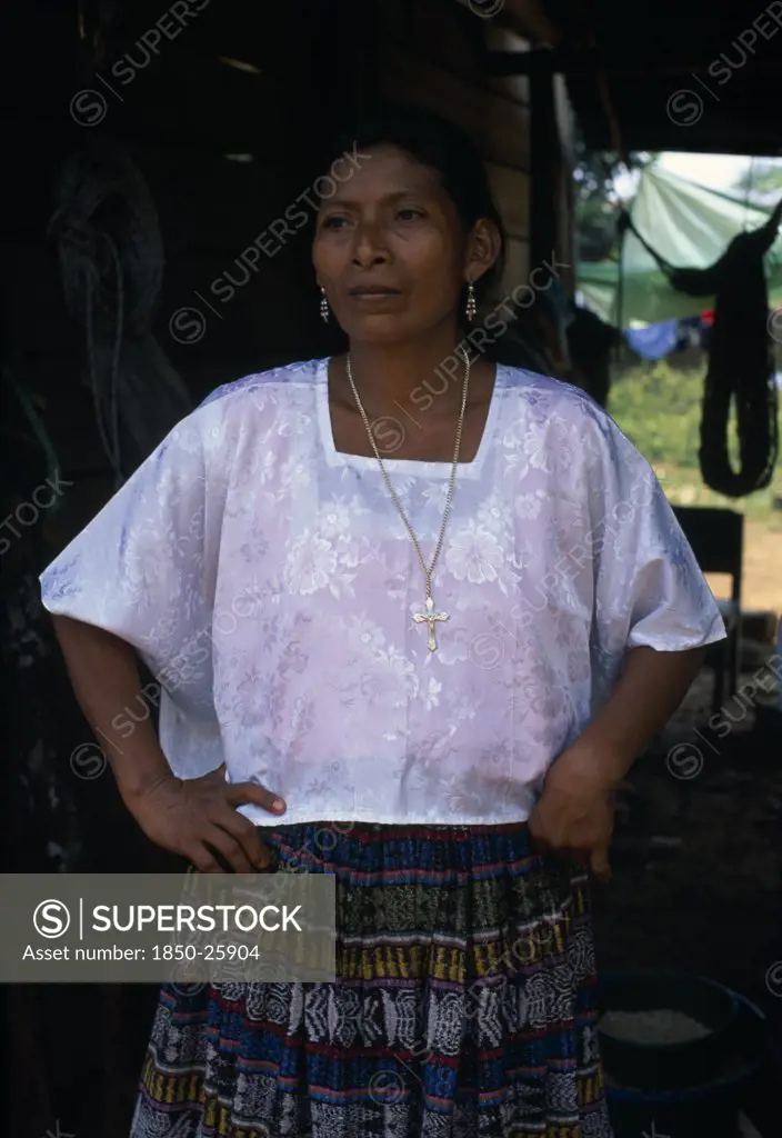 Guatemala, Alta Verapaz, Sacaak , Portrait Of A QEqchi Indian Mother Wearing A White Blouse And A Gold Crucifix Necklace In A Sacaak Refugee Settlement
