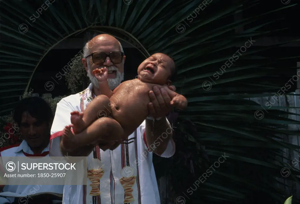 Guatemala, Alta Verapaz, Religion, Padre Tiziano An Italian Roman Catholic Missionary Baptising A QEqchi Indian Baby