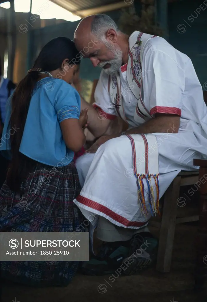 Guatemala, Alta Verapaz, Religion, Padre Tiziano An Italian Roman Catholic Missionary Taking Confession With A QEqchi Indian Girl
