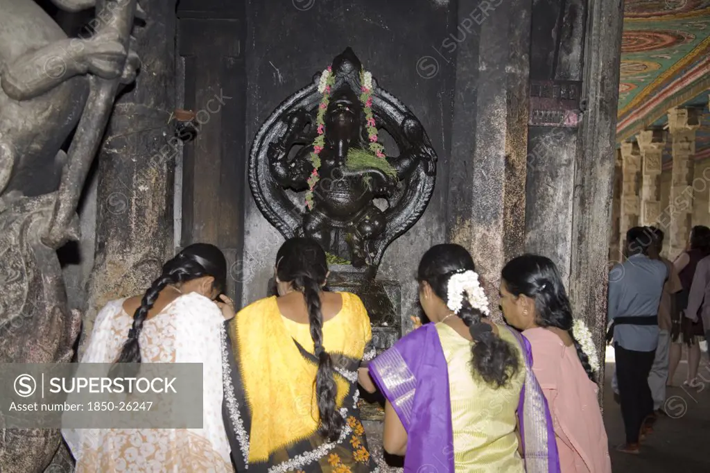 India, Tamil Nadu, Madurai, Female Worshippers Praying In Front Of A Ganesh Shrine Meenakshi Temple
