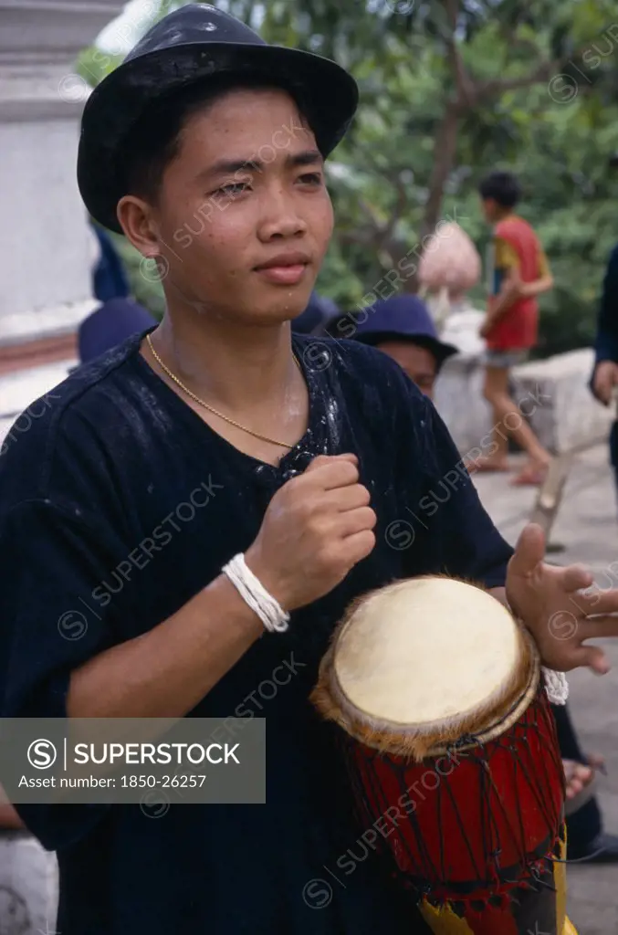 Laos, Luang Phrabang, Portrait Of Drummer Celebrating The Lunar New Year.