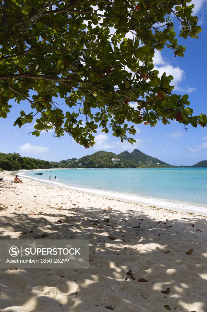 West Indies, Grenada, Carriacou, Waves Breaking On Paradise Beach At L'Esterre Bay With The Turqoise Sea And Point Cistern Beyond.