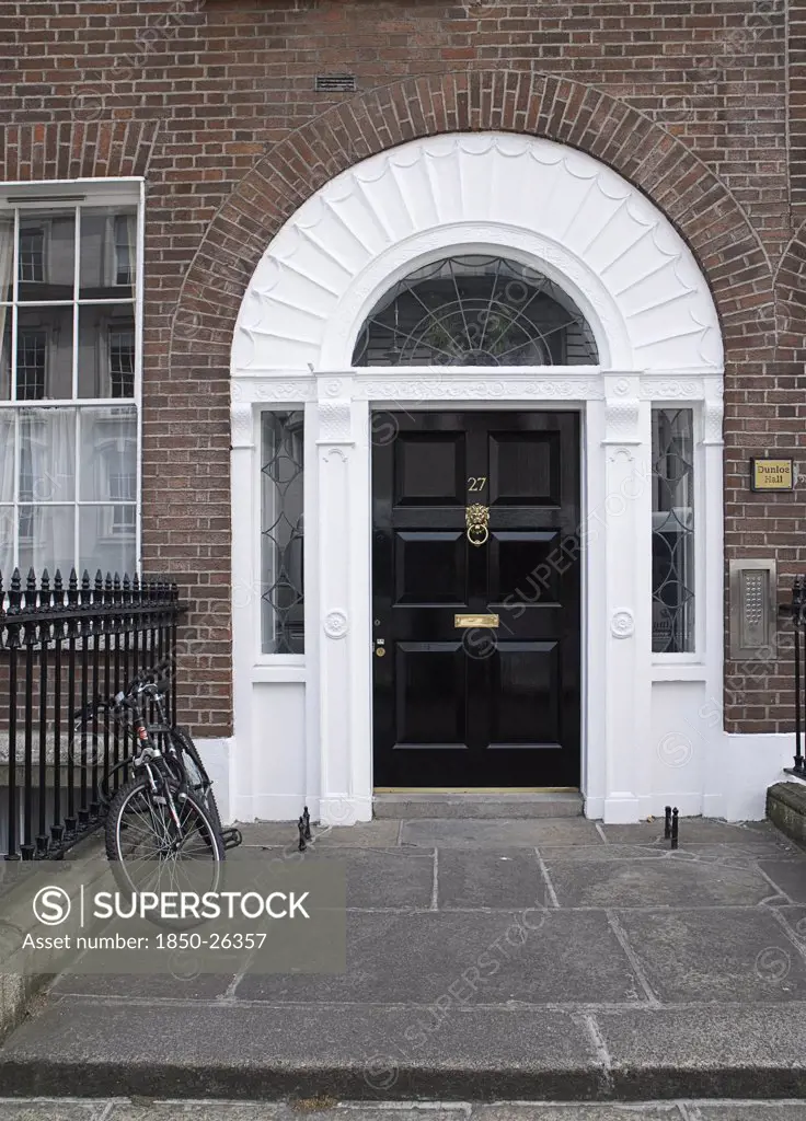 Ireland, Dublin, Dublin, Georgian Doorway Near Merrion Square With Black Door And White Arched Surround With Bicycle Outside