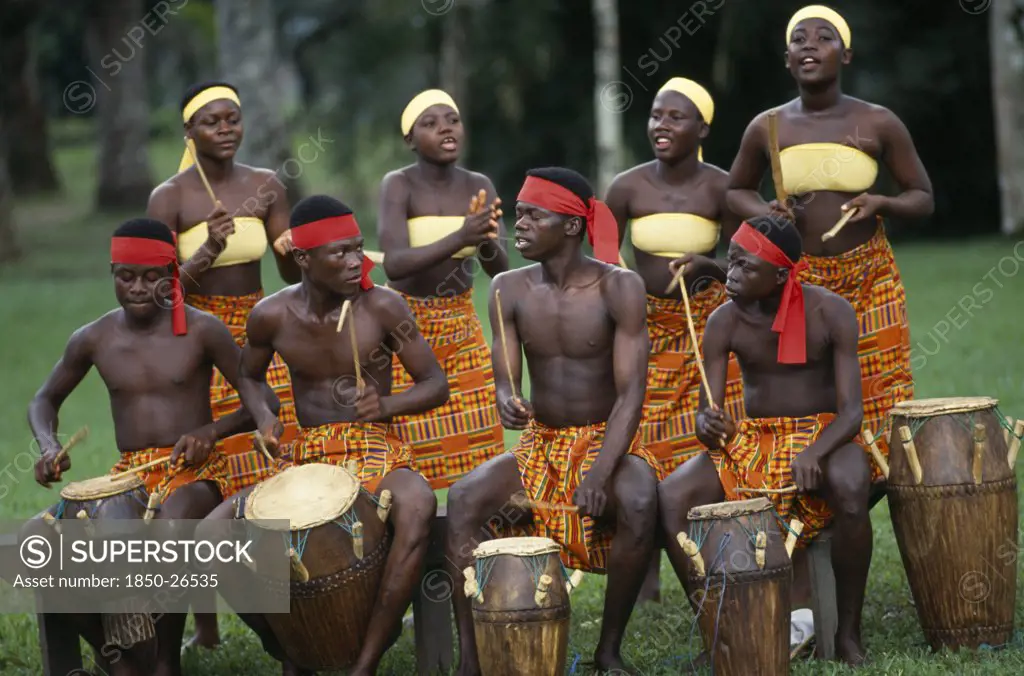Ghana, Accra, Tribal Drummers Dressed In Kente Cloth. Near Accra.