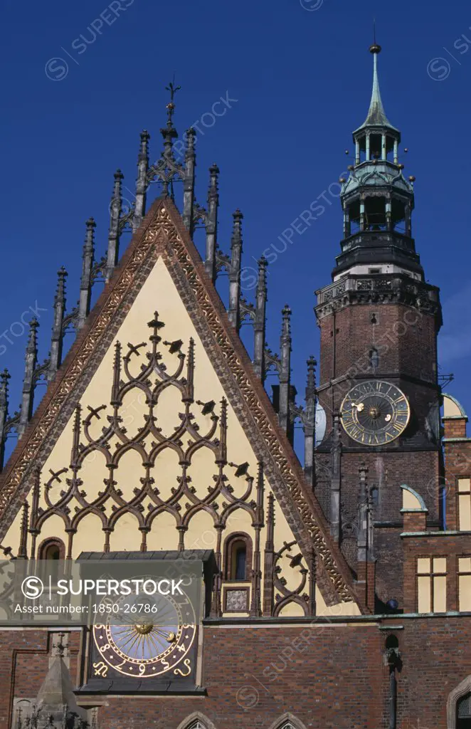 Poland, Wroclaw, Wroclaw Town Hall Dating From The Fourteenth Century.  Part View Of Exterior With Decorative Gable  Astronomical Clock And Clock Tower.