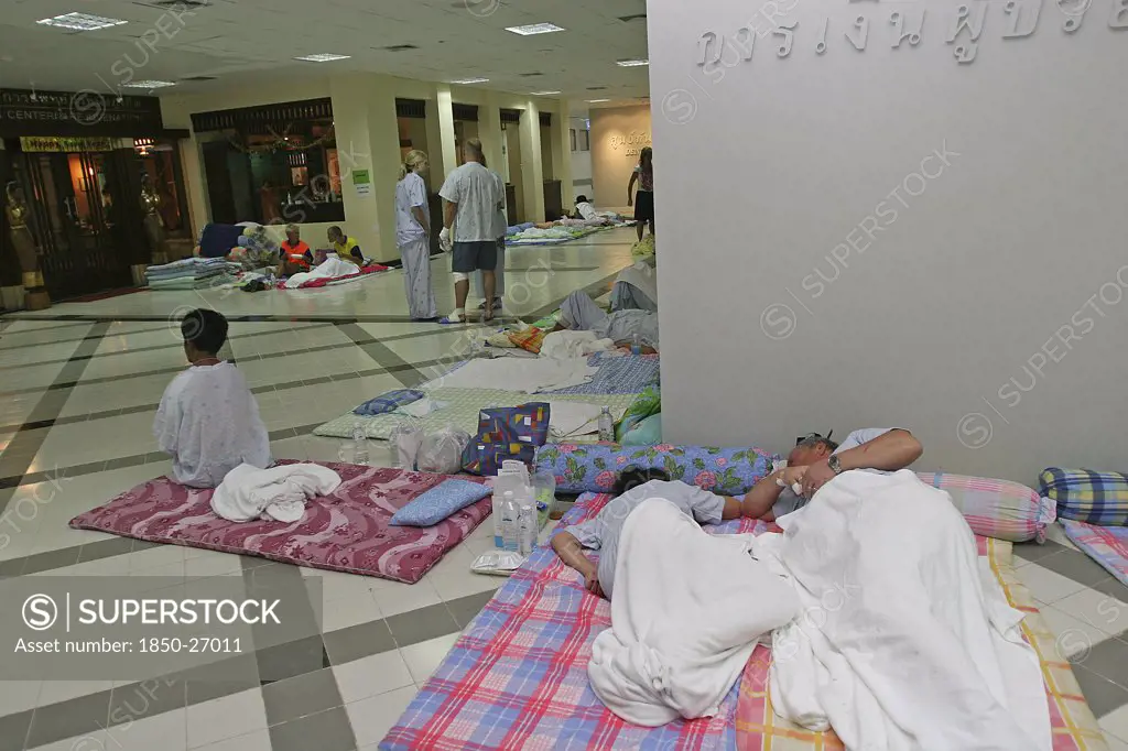 Thailand, Phang Nga District, Phuket, 'Tsunami Carnage The Day After. Foreign Tourists In The Bangkok Phuket Hospital, There Are So Many People That They Do Not Have Room And People Are Lane Out Where Ever They Can Find Space Like The Corridors And Waiting Rooms. On The 27Th Dec.'