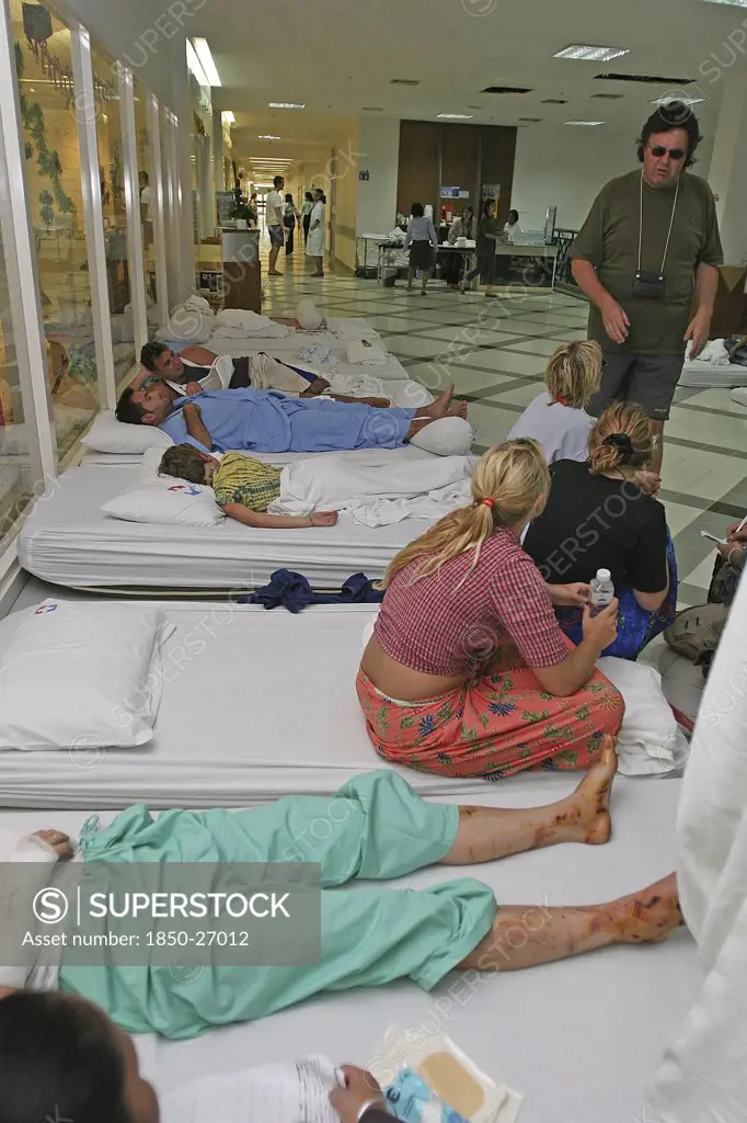 Thailand, Phang Nga District, Phuket, 'Tsunami Carnage The Day After. Foreign Tourists In The Bangkok Phuket Hospital, There Are So Many People That They Do Not Have Room And People Are Lane Out Where Ever They Can Find Space Like The Corridors And Waiting Rooms. On The 27Th Dec.'