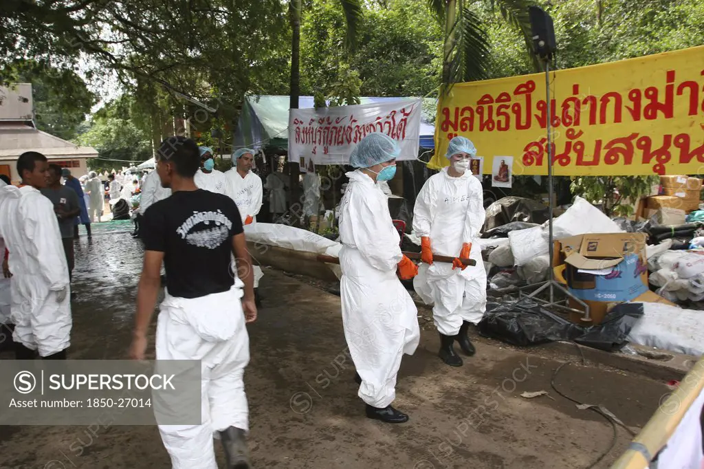 Thailand, Phang Nga District, Takua Pa, 'Tsunami. A Body Is Taken To Refridgerated Containers After Having Had Dna Taken From It, At The Temple Wat Yan Yao On The 7Th Jan.'