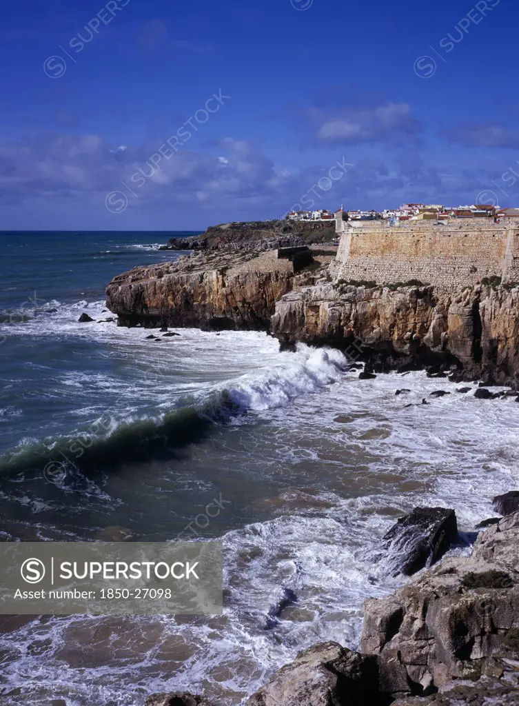 Portugal, Estremadura, Ribatejo, Peniche. Atlantic Ocean Town. Sea And Cliffs Topped By Part Of Curtain Wall To The 16Th Century Fortaleza Castle Situated South Of The Town.