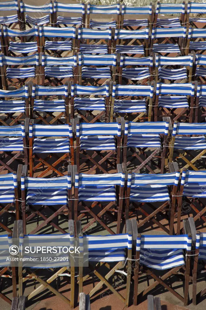 England, East Sussex, Eastbourne, Details Of Blue And White Deck Chairs At The Band Stand.
