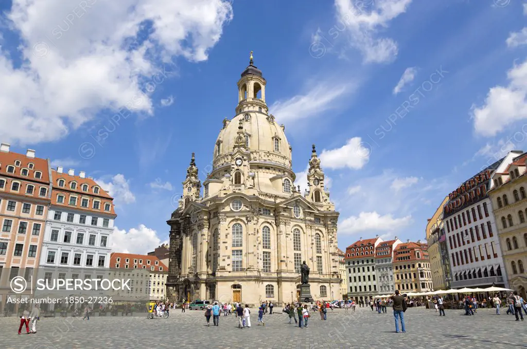 Germany, Saxony, Dresden, The Restored Baroque Church Of Frauenkirch And Surrounding Restored Buildings In Neumarkt Busy With Tourists.