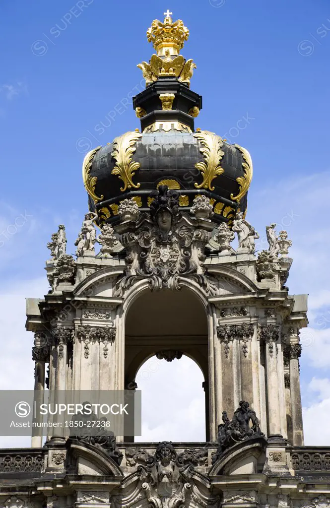 Germany, Saxony, Dresden, The Crown Gate Or Kronentor Of The Restored Baroque Zwinger Palace Originally Built Between 1710 And 1732 After A Design By Matthus Daniel Pppelmann In Collaboration With Sculptor Balthasar Permoser.