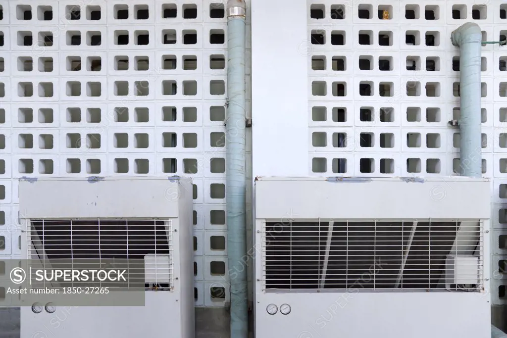 West Indies, St Vincent & The Grenadines, Union Island, Airconditioning Units Outside An Industrial Building In Clifton.
