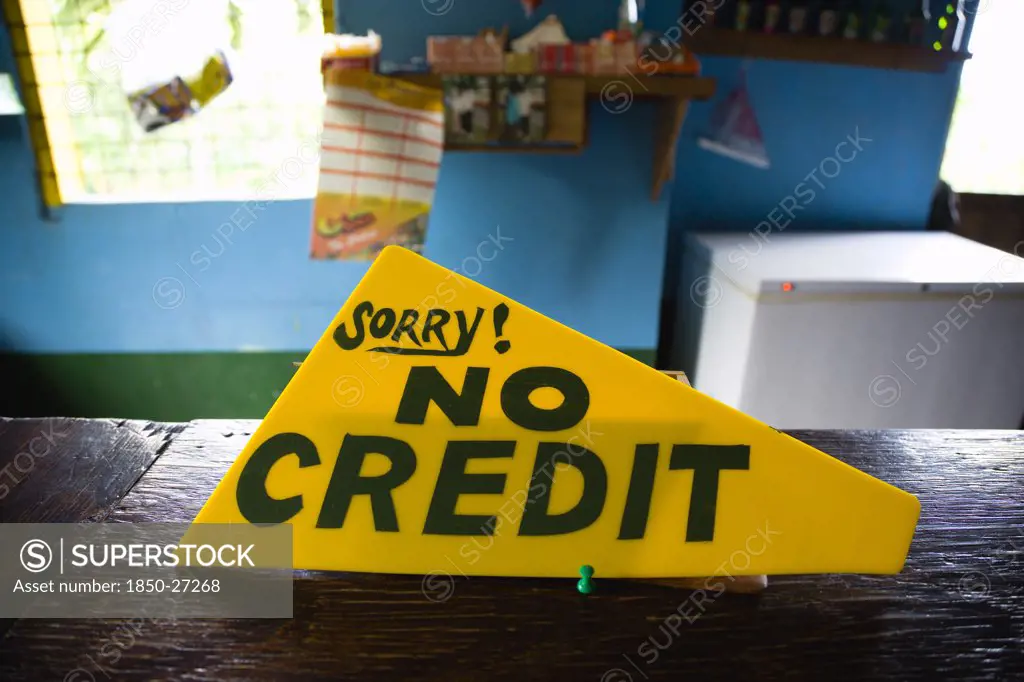 West Indies, Grenada, St Georges, Sign On The Counter Of A Shop That Says Sorry No Credit.