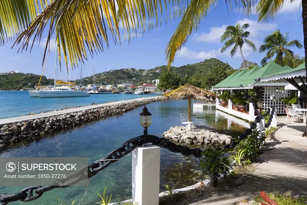 West Indies, St Vincent & The Grenadines, Union Island, The Capital Of Clifton And The Harbour Seen From The Terrace Of The Anchorage Yacht Club Restaurant And Bar Beside The Shark Pool.