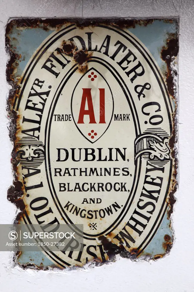 Ireland, North, Belfast, 'Cathedral Quarter, Commerical Court, Old Metal Whiskey Sign Decorating The Exterior Of The Duke Of York Public House.'