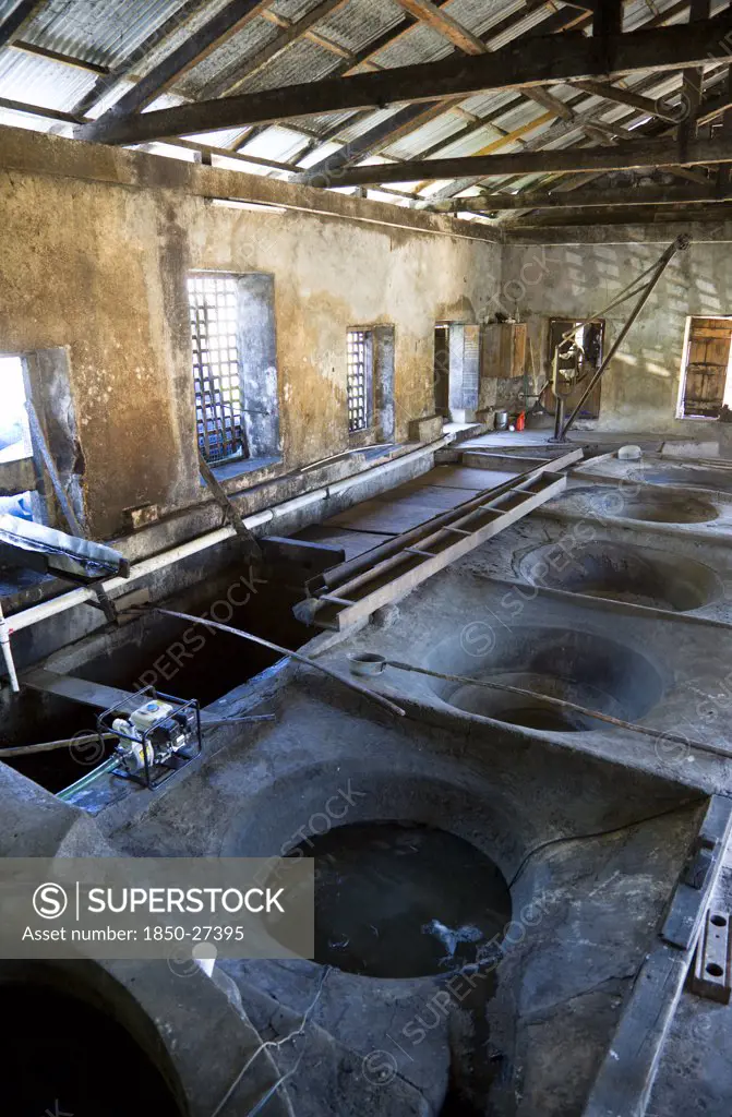 West Indies, Grenada, St Patrick, The Ancient Copper Vats For Boiling The Sugarcane Juice At The River Antoine Rum Distillery.