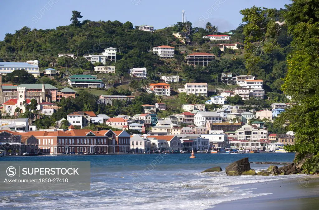 West Indies, Grenada, St George, The Hillside Buildings And Waterfront Of The Carenage In The Capital St Georges Seen From Pandy Beach Beside Port Louis Marina.