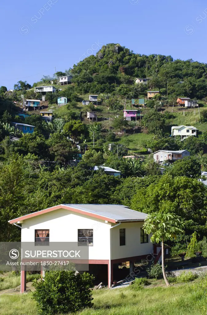 West Indies, Grenada, St George, Houses Built On Stilts Lining A Hillside.